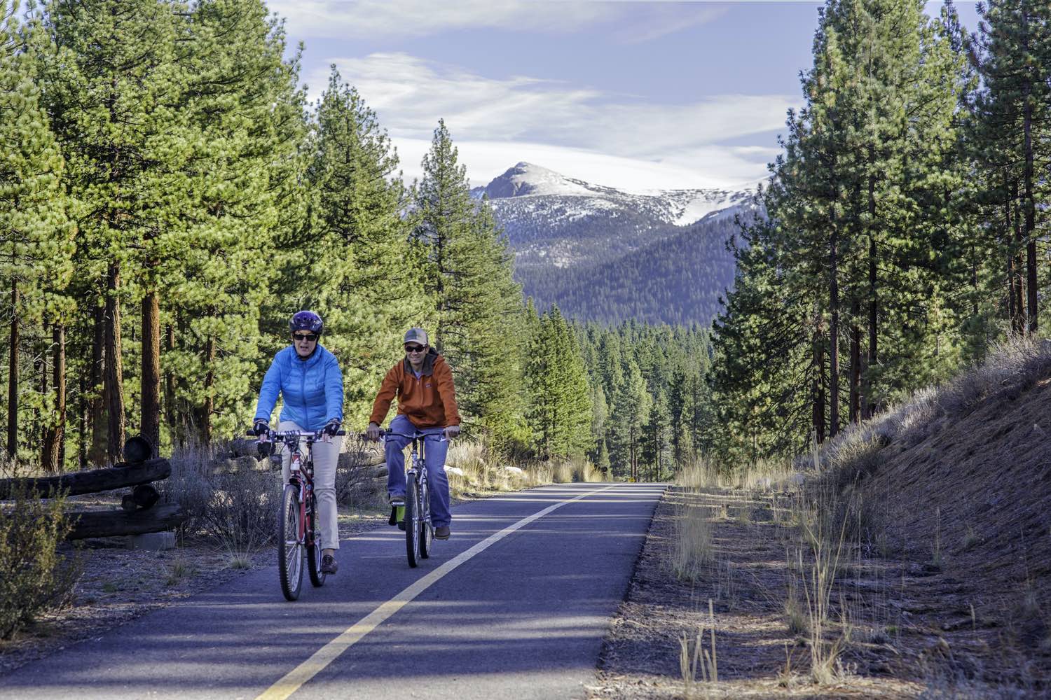 A commuter cyclist riding through Lake Tahoe on the way to work.